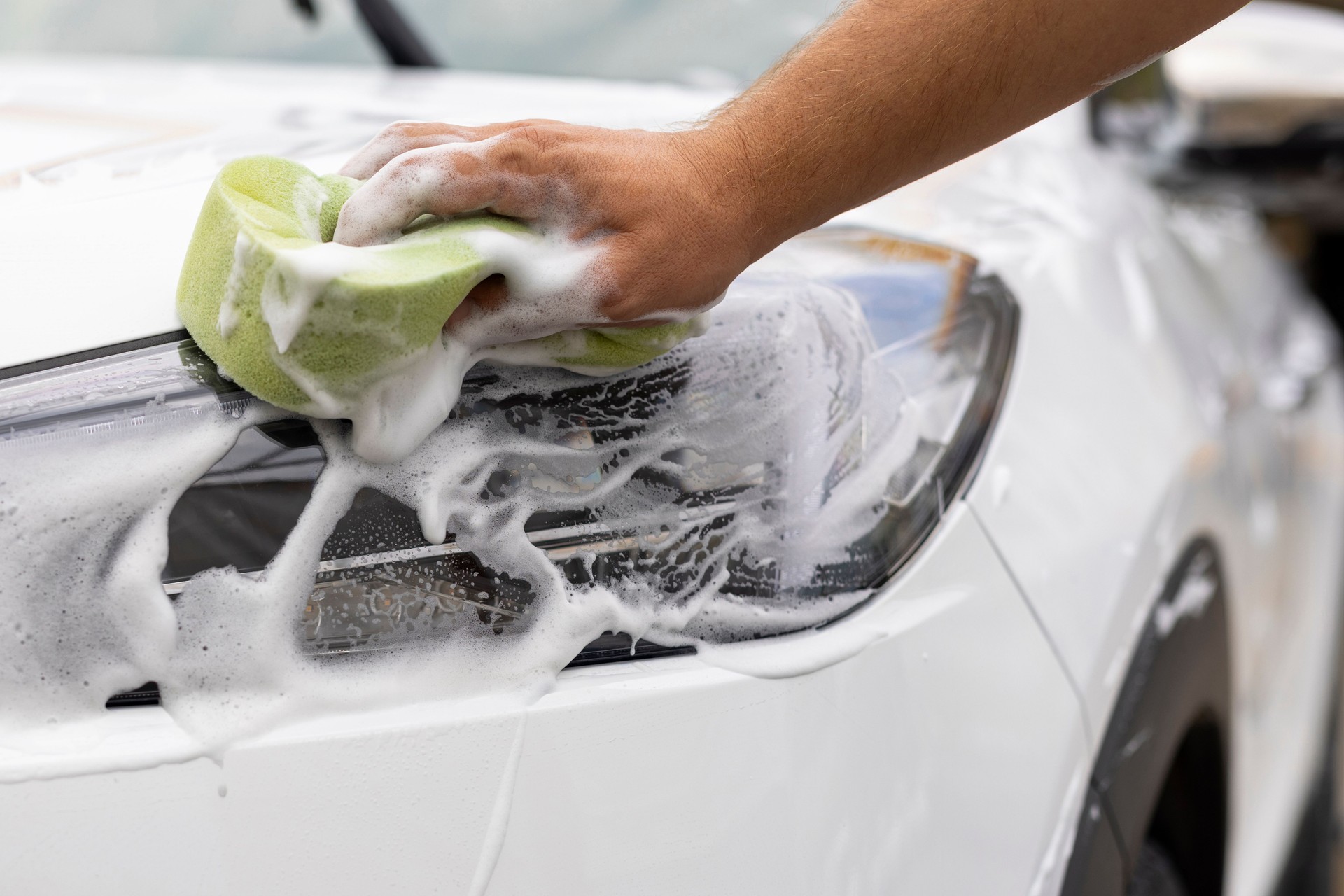 Man soaping his car